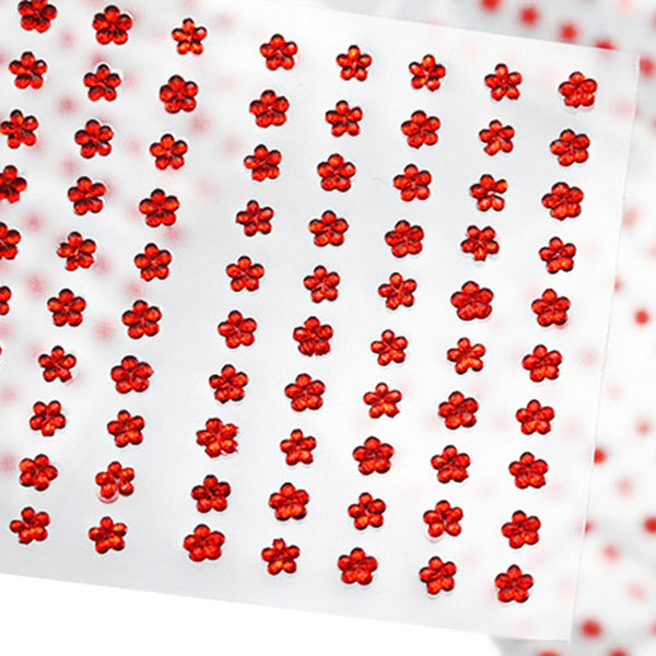 Gemmes rouges autocollantes sur les fleurs